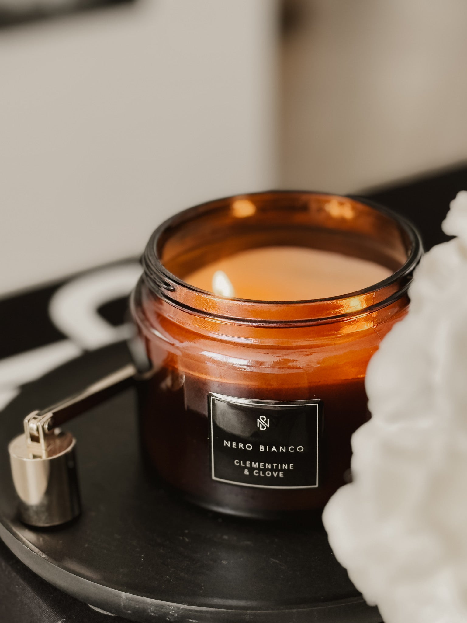 CLEMENTINE AND CLOVE DUAL WICK AMBER CANDLE WITH GOLD CANDLE SNUFFER