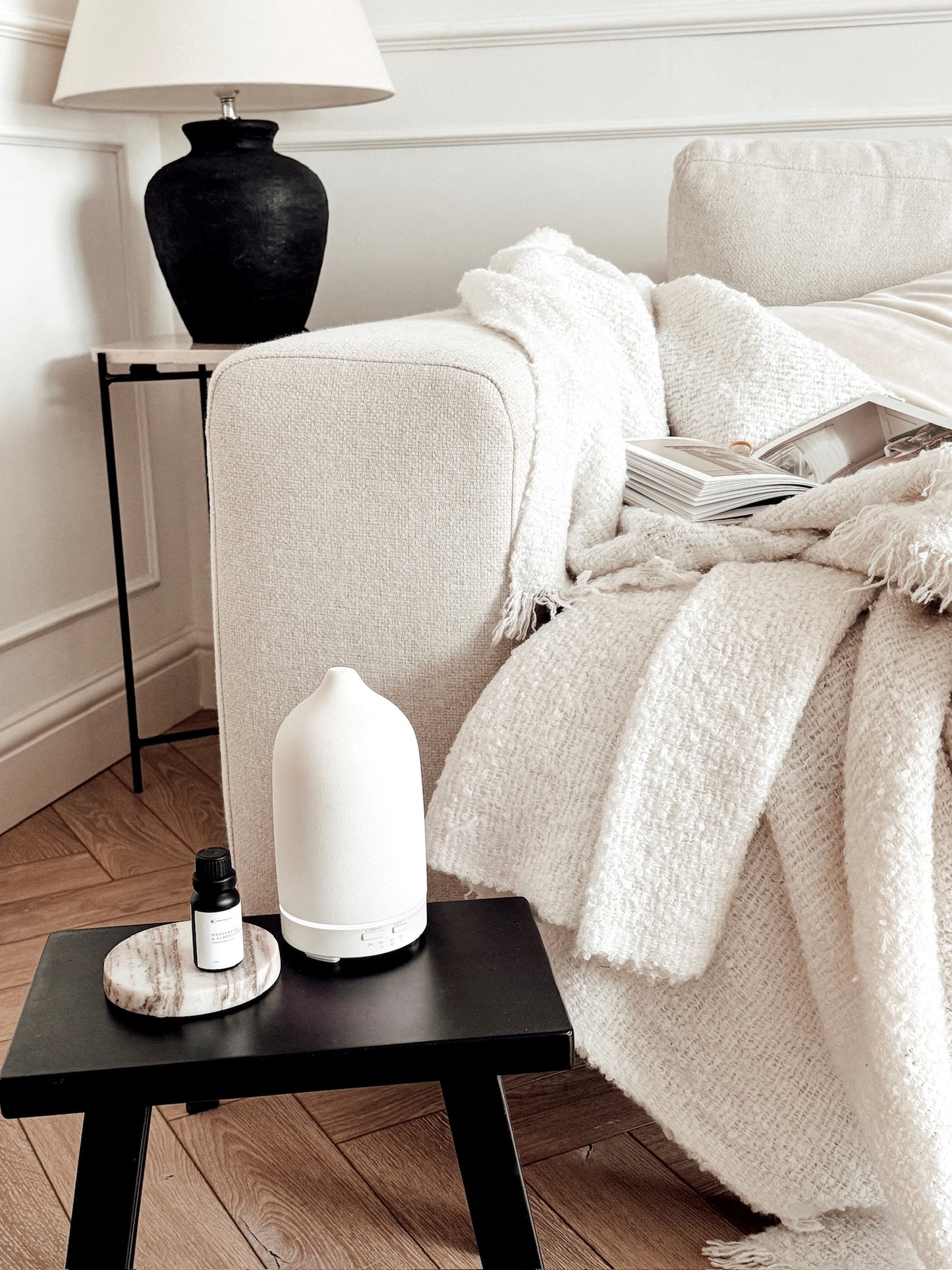 Ceramic Aroma Diffuser with aroma oil in a neutral living room
