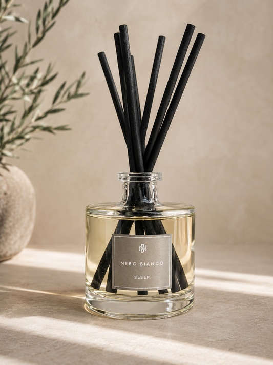 Nero Bianco diffuser with black reeds on a neutral background