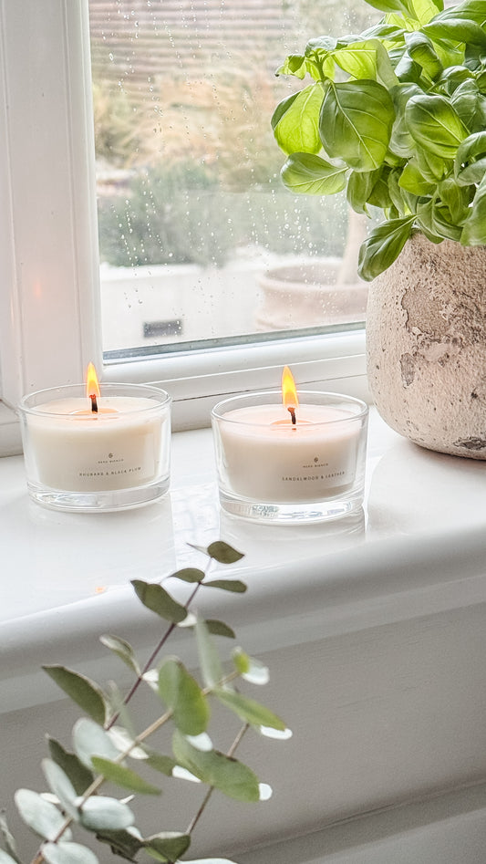 Votive Candles in glass vessels on a kitchen window edge
