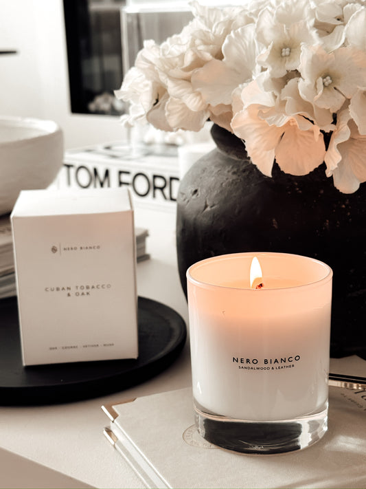 sandalwood and leather vegan candle in white glass