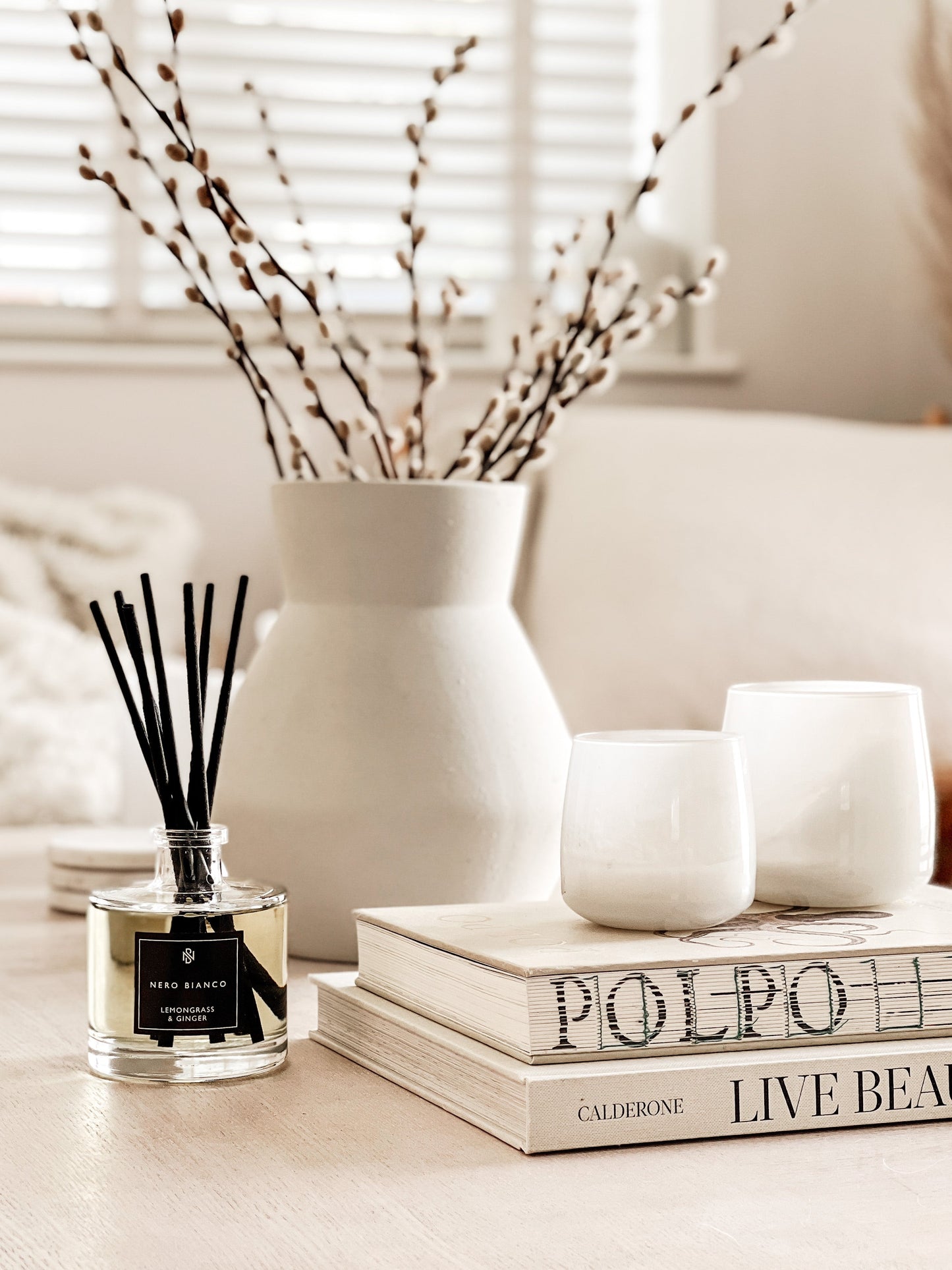 Signature Reed Diffuser lemongrass and ginger on coffee table in neutral home