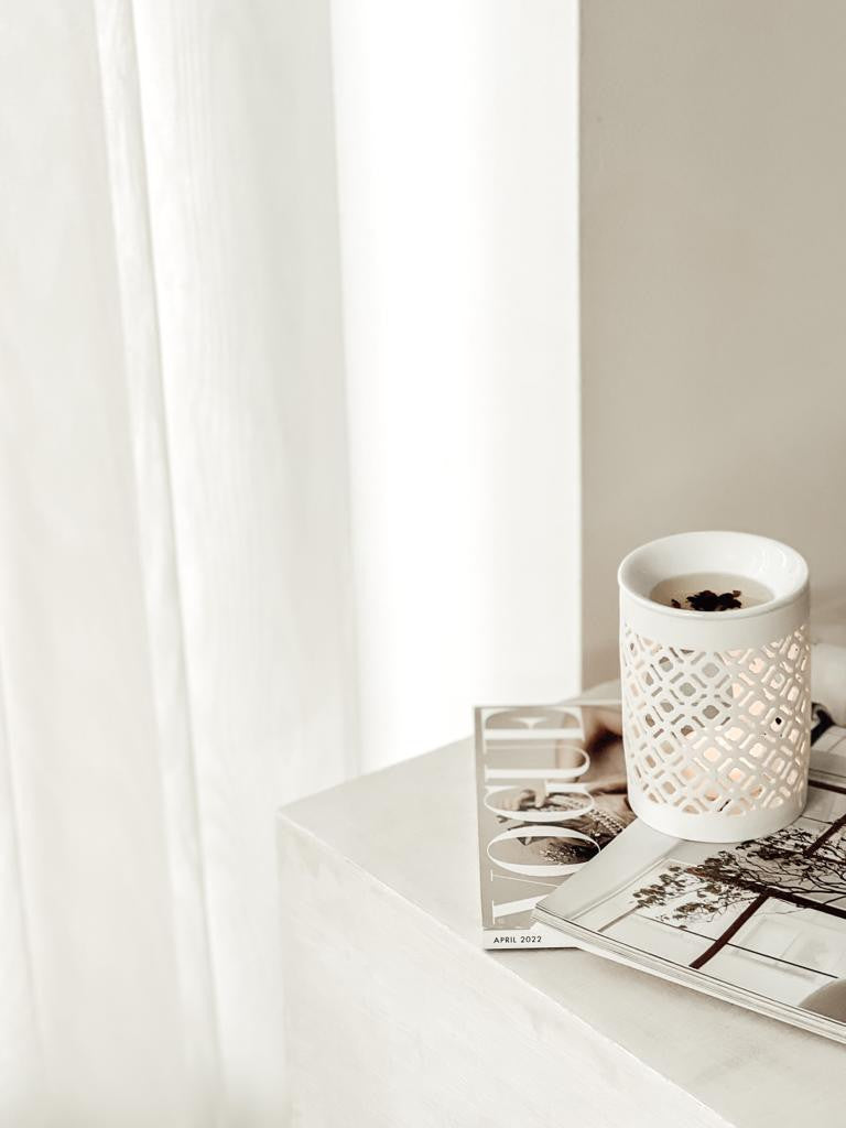 white ceramic wax melt burner in a neutral home