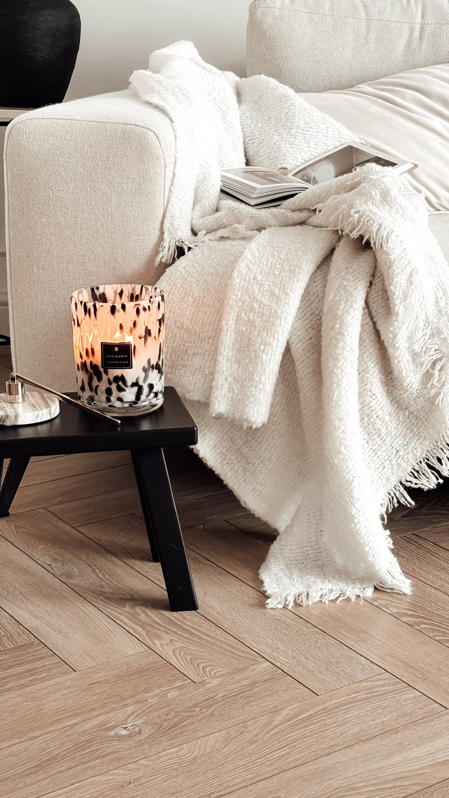Dalmatian Print Candle close up in a neutral living room