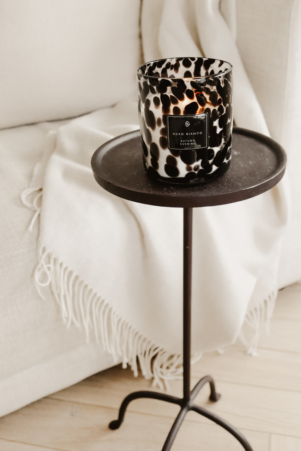 AUTUMN EVENING DUAL WICK CANDLE ON SMALL SIDE TABLE