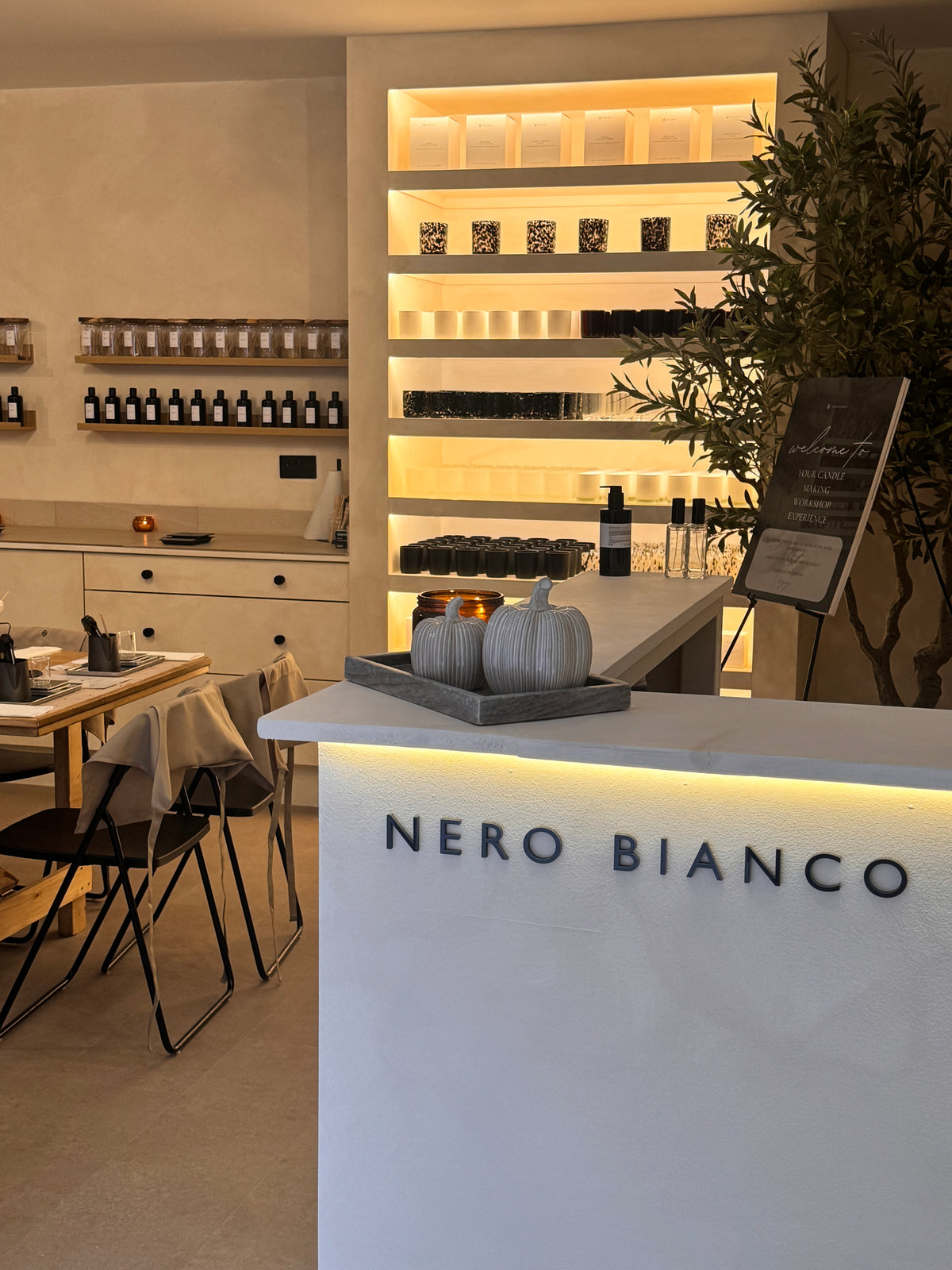 Nero Bianco workshop interior with decor and branding.