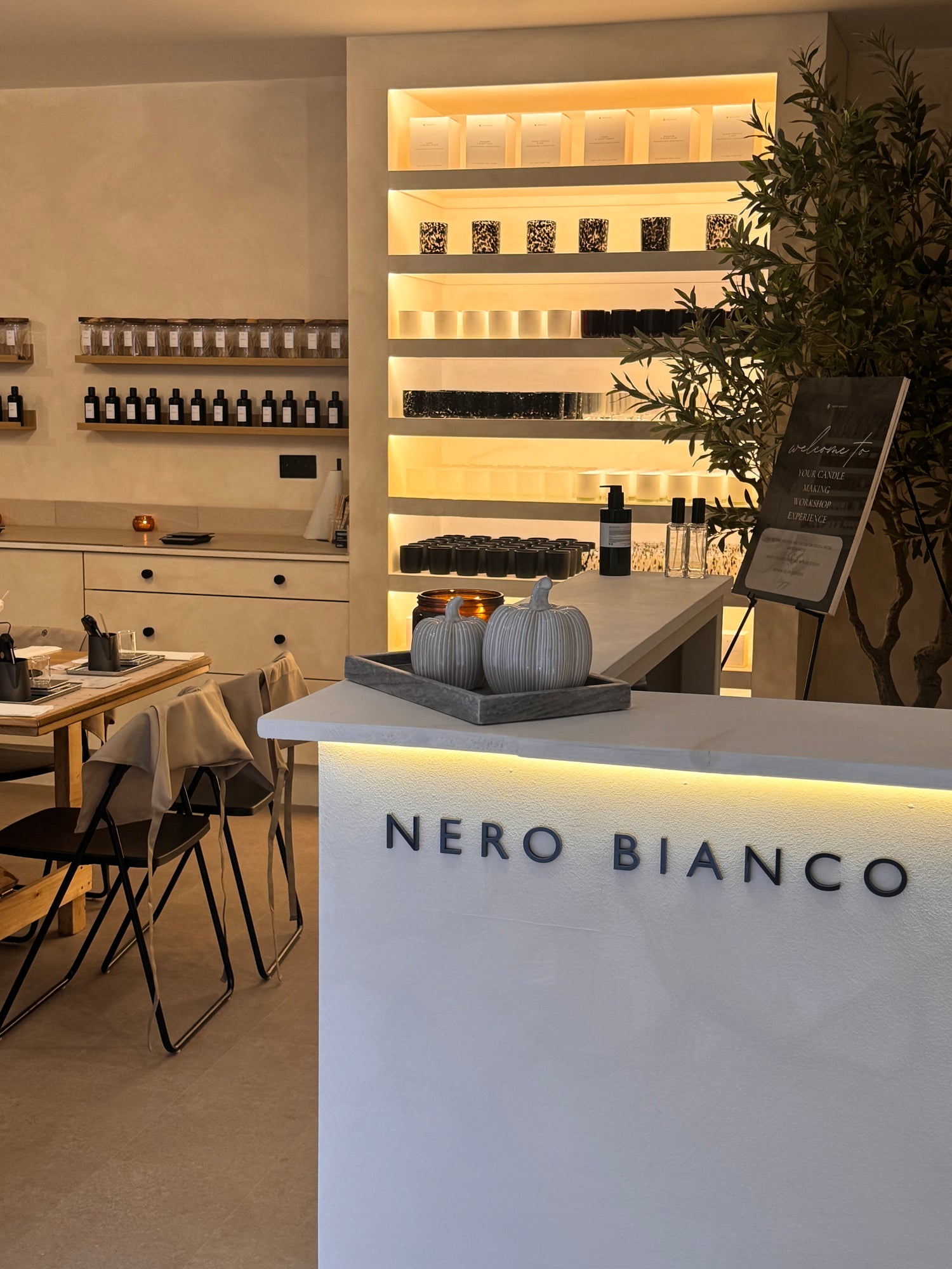 Nero Bianco workshop interior with decor and branding.