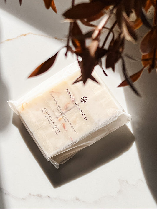 pumpkin and spice soy wax melts styled with autumnal leaves