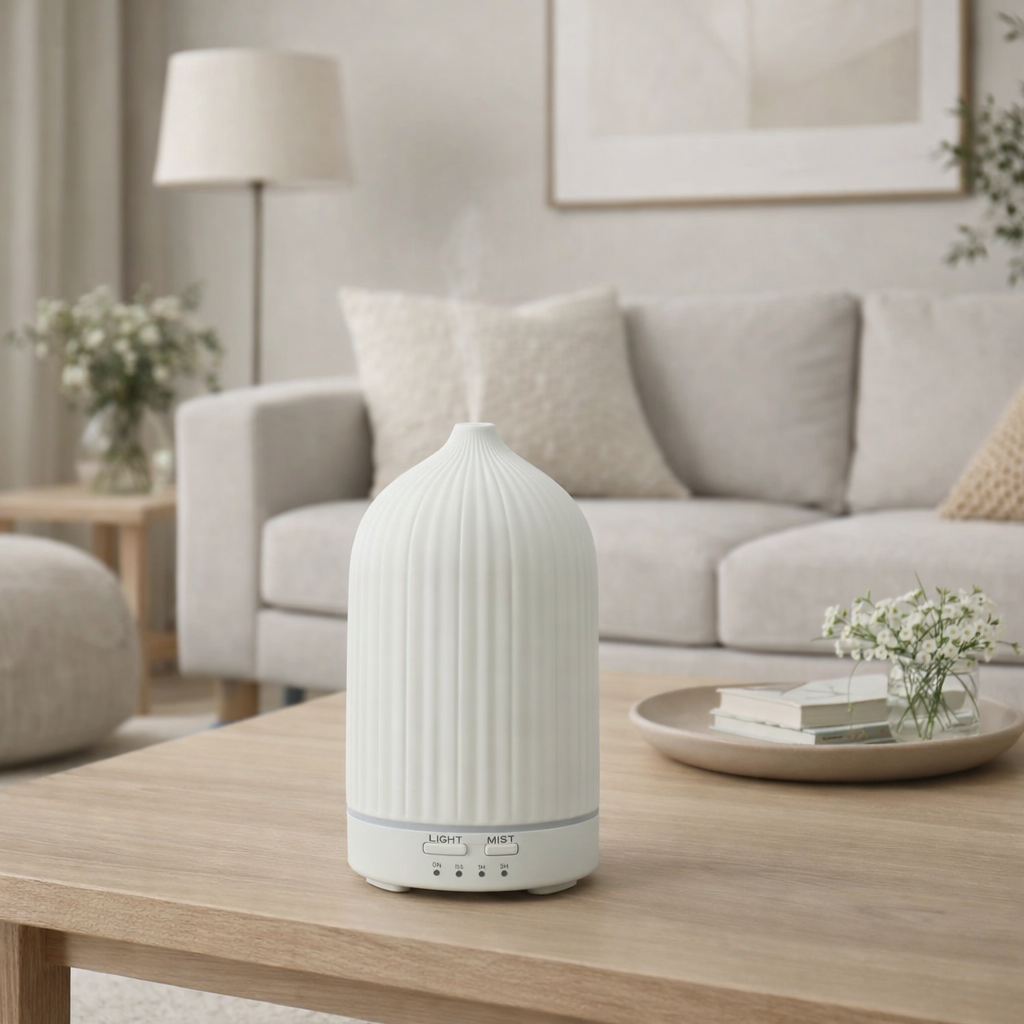 White diffuser on a wooden table in a living room setting