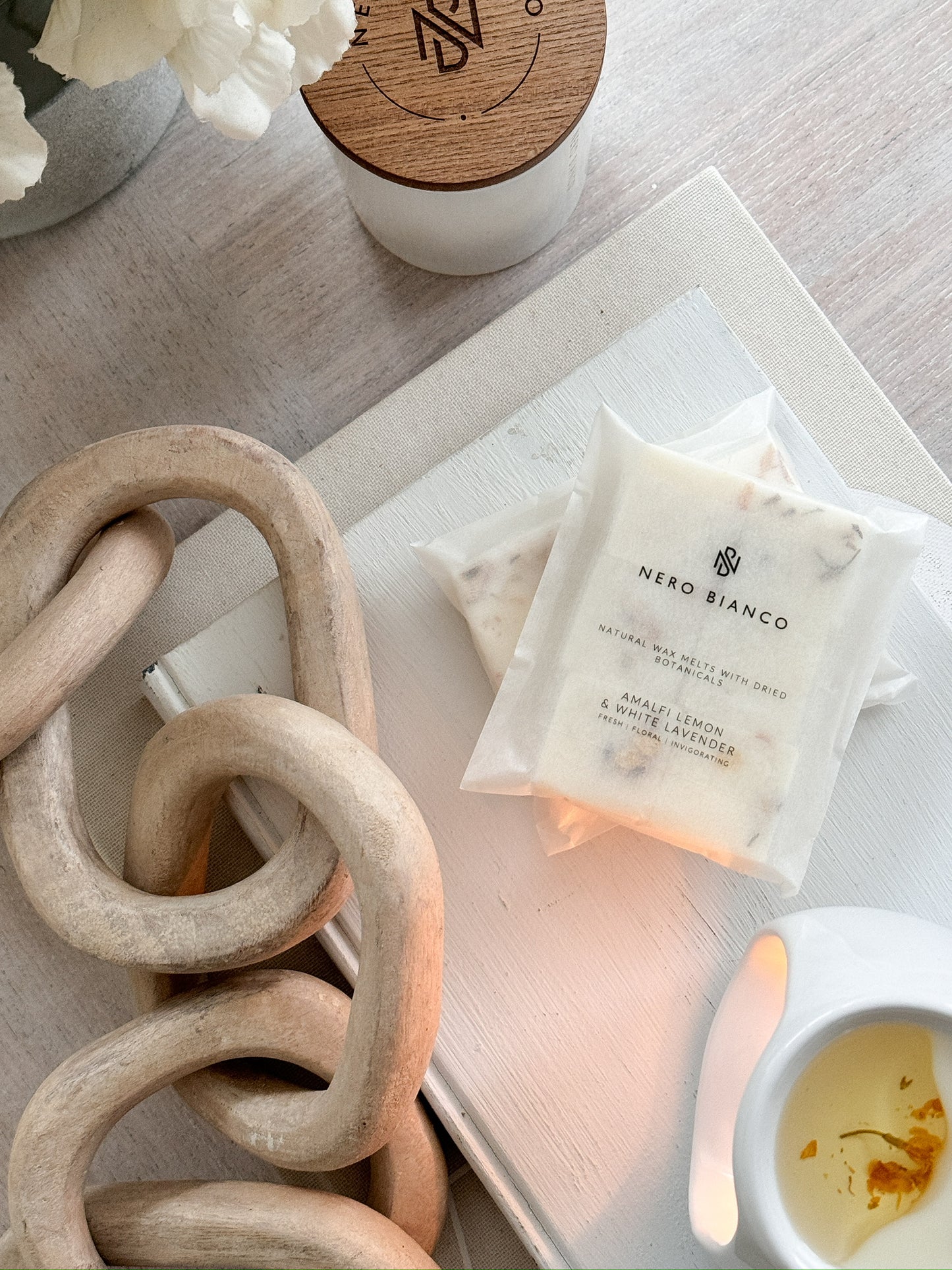 A pack of Nero Bianco wax melts placed on a white surface, with the brand's label visible on the packaging.