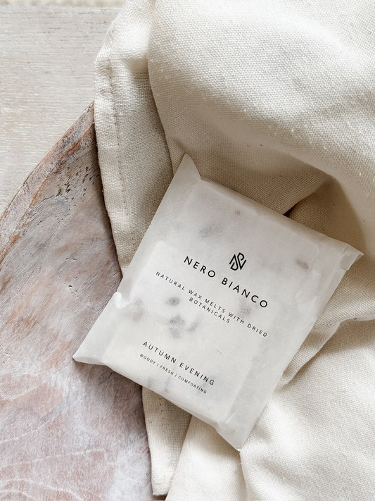 autumn scented wax melts on a neutral bowl and linen