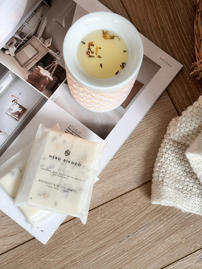 A pack of Nero Bianco wax melts placed on a white surface, with the brand's label visible on the packaging.
