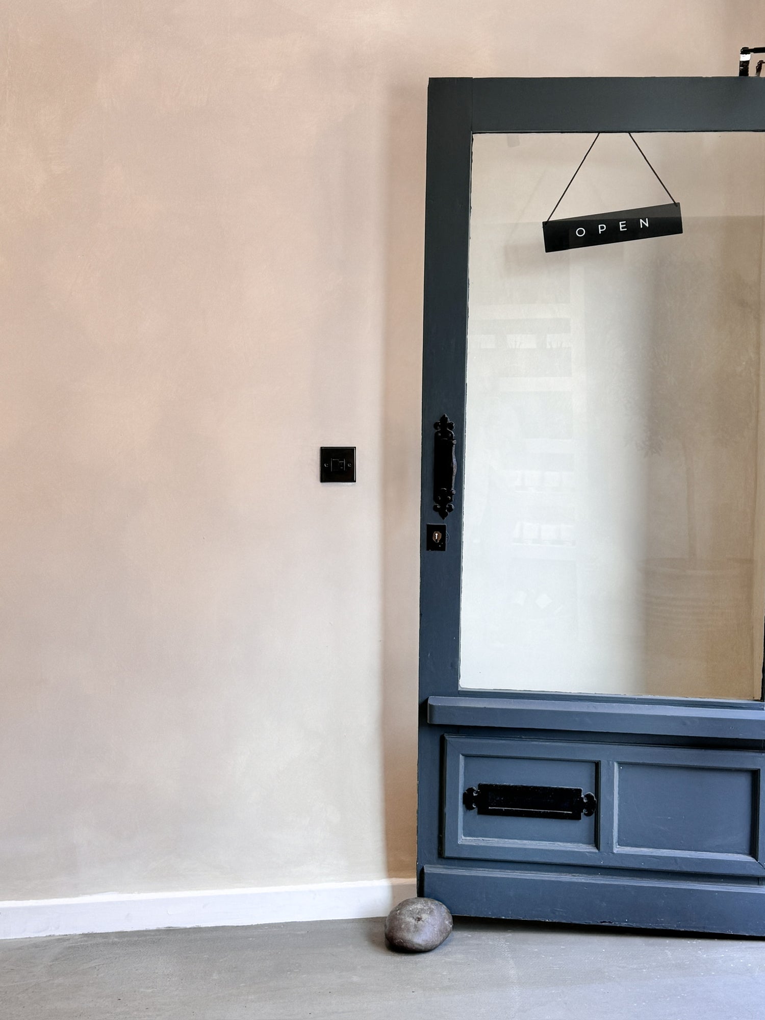 open sign of Nero Bianco candle shop in lichfield with limewash paint