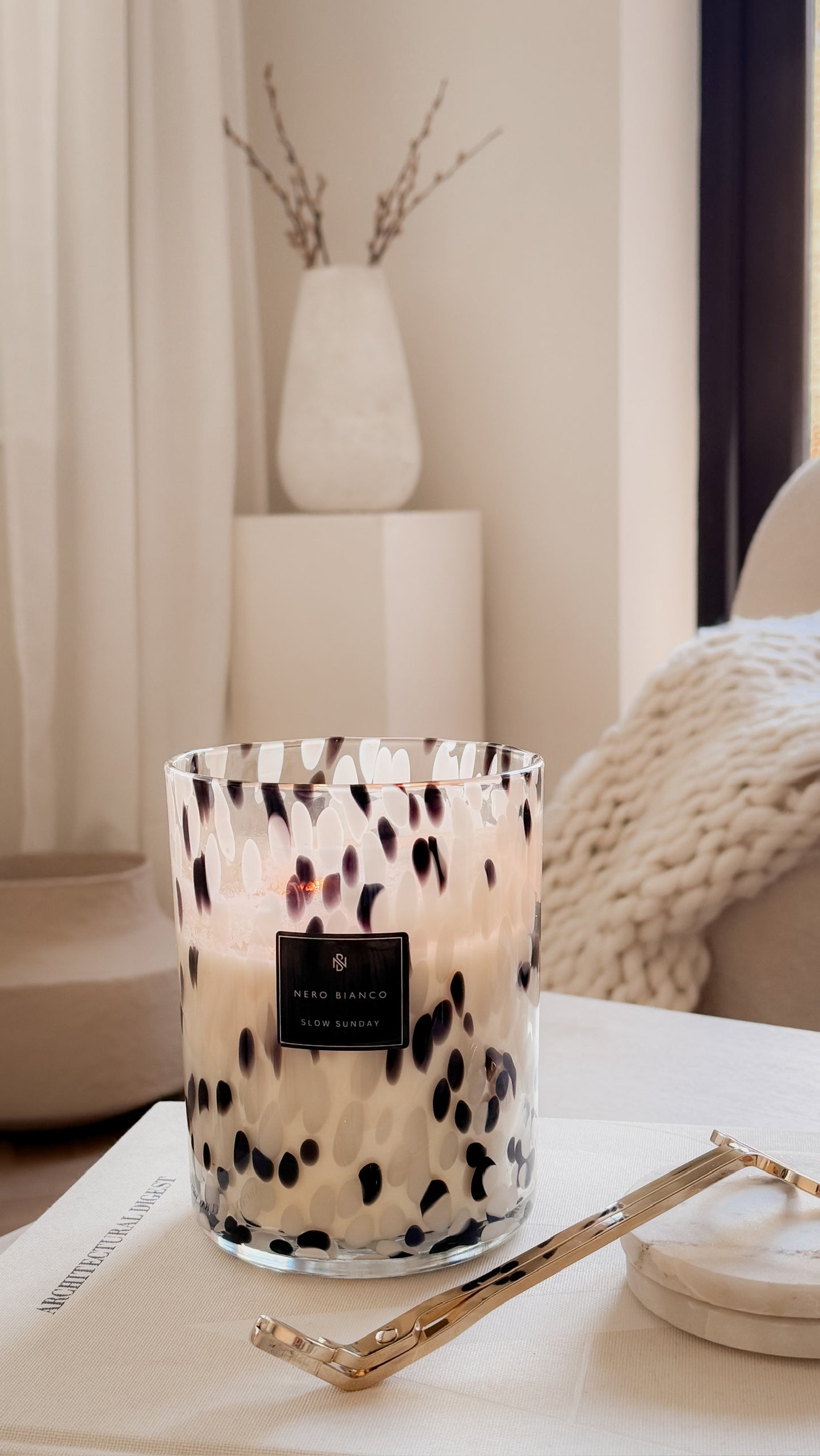 Candle with a pattern in a room setting