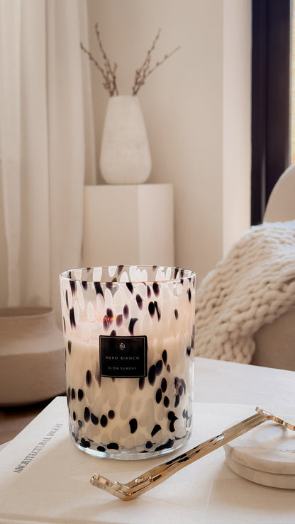 Candle with a pattern in a room setting