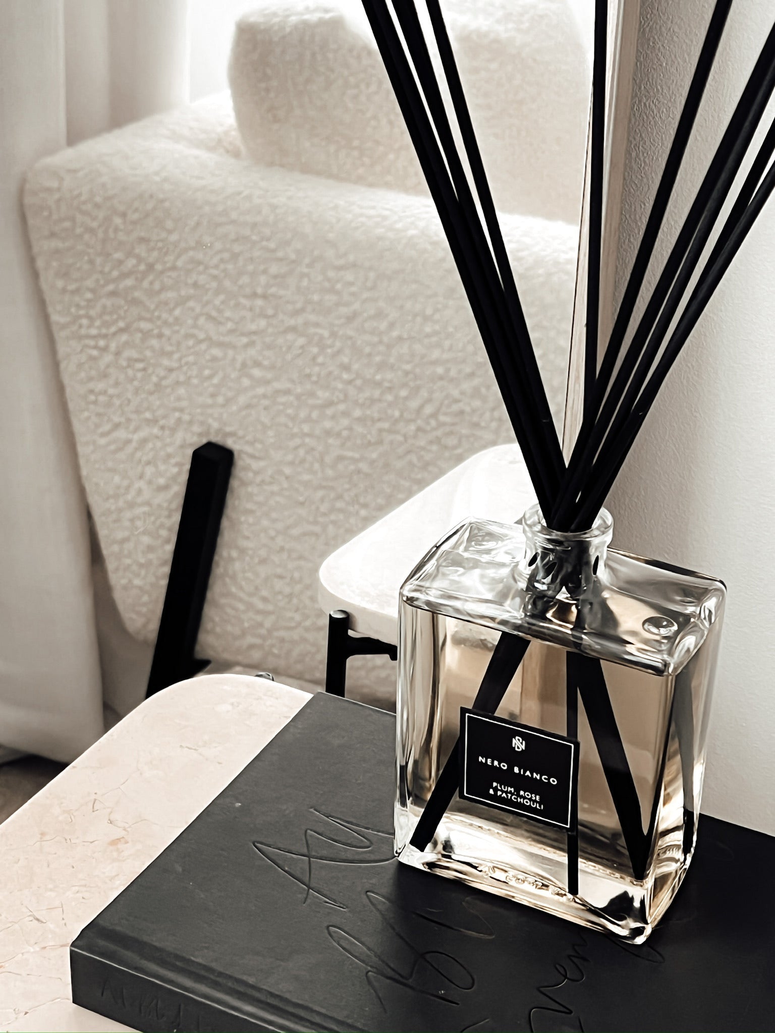 large rectangular reed diffuser styled in a neutral home