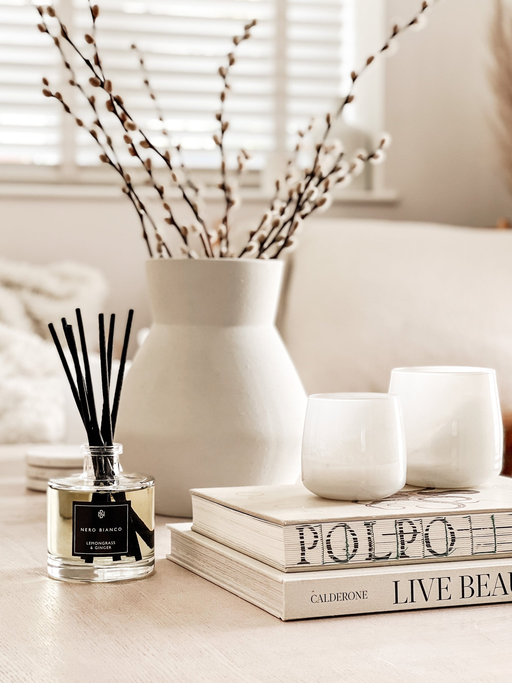 Signature Reed Diffuser lemongrass and ginger on coffee table in neutral home