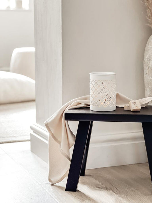 white ceramic wax melt burner in a neutral home decor